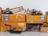a lot of construction vehicles that are sitting on a table