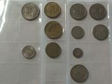 a lot of coins that are in a plastic container