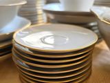 a lot of plates that are stacked on a table