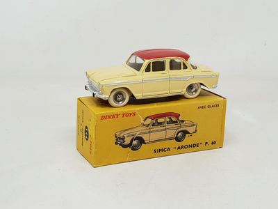 a yellow toy car on top of a yellow box