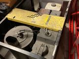 a metal cart with a box on top of it