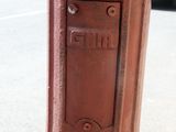 a red fire hydrant sitting on the side of the road