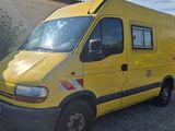 a man standing in front of a yellow van