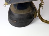 a helmet with a chain attached to it on a white surface