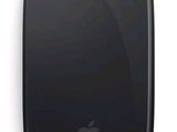 an apple mouse is shown on a white surface with a black background