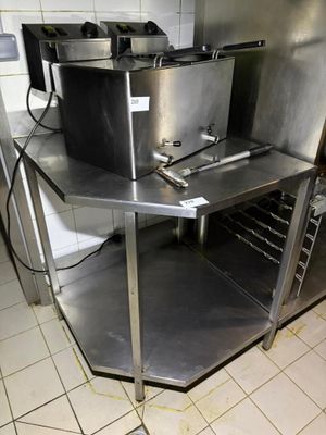 a kitchen with stainless steel appliances and a tile floor