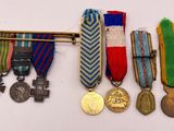 several medals and medals are displayed on a white surface