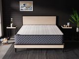 a mattress that is sitting on a bed in a room