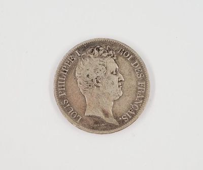 a close up of a coin on a white surface