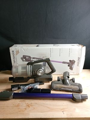 a box of vacuum cleaners and other tools on a table