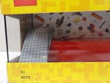a yellow and red lego box with a red door