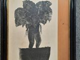 painting of an elephant standing on a potted plant in a black frame