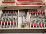 a wooden box with a set of silverware in it