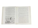 an open book with a drawing of a man riding a horse