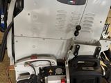 a machine that is sitting on the ground in the garage