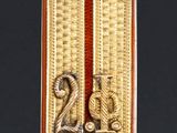 an image of a gold and red tag with the number twenty on it