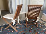 two chairs in a room with a rug on the floor