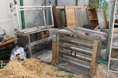 a pile of old windows and other junk in a room