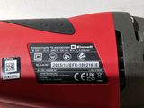 an image of a close up of a red and black corded drill