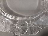 a clear glass plate with a leaf design on it