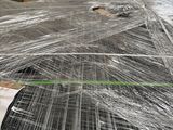 many pieces of wire wrapped in plastic on the floor