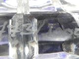 a close up picture of a glass block with ice on it