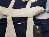 a blue and white tote bag and a blue and white tote bag