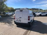 a white van that is parked in a parking lot