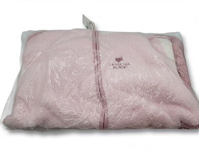 a pink blanket that has a tag on it