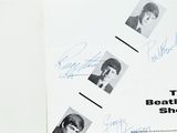an image of a book with autographs of the beatles on it