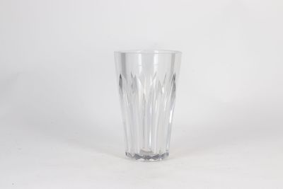 a clear glass that is sitting on a table