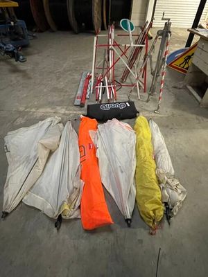 many umbrellas that are laying on the ground