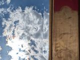 a picture of a picture of a sky and clouds in a mirror