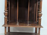 a wooden shelf with two doors and a shelf with two drawers