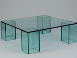 a glass table with a glass top on a white background