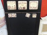 a black cabinet with a lot of magnets on it
