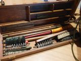 a wooden box with tools in it on a table
