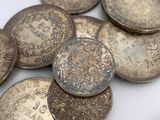 a pile of coins sitting on a table next to a coin