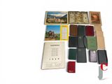 a lot of books that are laying out on the table