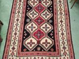 an oriental rug on the floor in a living room