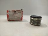 a close up of a metal object on a table near a box