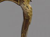 an image of a small table with a gold decoration on it