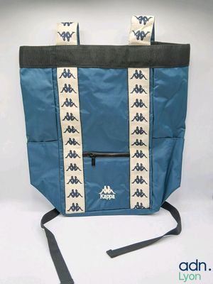 a blue tote bag with arrows and arrows on it