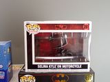 two boxes of batman pop vinyl figures sit on a table