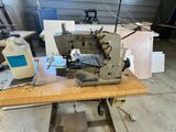 a sewing machine that is sitting on a table