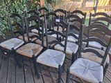 six chairs that are sitting on a wooden deck