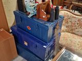 boxes stacked on top of each other with a clock on top of them