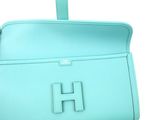 tiffany blue leather handbag with a h logo on the front