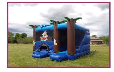 a inflatable bouncer with a pirate theme on it