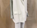 an image of a mannequin wearing a white vest and white pants